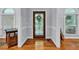 Foyer featuring hardwood floors, decorative wooden front door and wainscotting at 7212 Avalon Dr, Douglasville, GA 30135