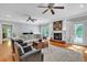 Inviting living room with hardwood floors, fireplace, French doors, and neutral color scheme at 7212 Avalon Dr, Douglasville, GA 30135