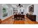 Office space featuring hardwood floors, large windows and built-in bookshelves at 7212 Avalon Dr, Douglasville, GA 30135