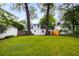 A lush backyard is framed by mature trees, perfect for outdoor relaxation and recreation at 1981 N Decatur Ne Rd, Atlanta, GA 30307