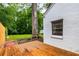 Backyard with a wooden deck, a large shade tree and a swing at 1981 N Decatur Ne Rd, Atlanta, GA 30307