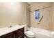 Nicely tiled bathroom with a tub, shower and a decorative stained glass window at 1981 N Decatur Ne Rd, Atlanta, GA 30307