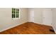 Bright bedroom features hardwood floors, white trim and neutral paint at 1981 N Decatur Ne Rd, Atlanta, GA 30307