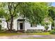 Beautiful one-story home boasting a landscaped front yard and mature tree canopy, creating a welcoming entrance at 1981 N Decatur Ne Rd, Atlanta, GA 30307