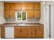 Kitchen with wood cabinets, laminate countertops, and white appliances at 1981 N Decatur Ne Rd, Atlanta, GA 30307