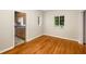 Sun-lit living room featuring wood floors and an open view into the kitchen with wood cabinetry at 1981 N Decatur Ne Rd, Atlanta, GA 30307
