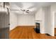 Bright living room boasts hardwood floors, a ceiling fan, fresh paint, and a classic fireplace mantel at 1981 N Decatur Ne Rd, Atlanta, GA 30307