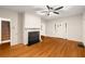 Spacious living room boasts hardwood floors, a ceiling fan, fresh paint, and a charming fireplace mantel at 1981 N Decatur Ne Rd, Atlanta, GA 30307