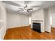 Inviting living room features hardwood floors, a ceiling fan, fresh paint, and a classic fireplace mantel at 1981 N Decatur Ne Rd, Atlanta, GA 30307