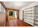 Sun room featuring wood paneled walls, tile flooring, and shelving at 1981 N Decatur Ne Rd, Atlanta, GA 30307