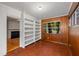 Sun room with built-in shelves, wood paneling, and tile flooring at 1981 N Decatur Ne Rd, Atlanta, GA 30307