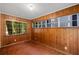 Cozy sun room with multiple windows and wood paneled walls at 1981 N Decatur Ne Rd, Atlanta, GA 30307