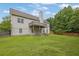 A sprawling green backyard featuring a deck and potential for various outdoor activities at 4591 Millstone Walk Ne Dr, Buford, GA 30519