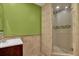 Tiled bathroom with modern fixtures and a glass-enclosed shower at 4591 Millstone Walk Ne Dr, Buford, GA 30519