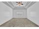 Bedroom featuring a neutral carpet, large window and stylish ceiling at 4591 Millstone Walk Ne Dr, Buford, GA 30519