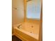 Well-lit bathtub, perfect for unwinding after a long day at 5123 Upper Elm St, Atlanta, GA 30349