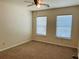 Bedroom with ceiling fan, neutral walls and carpeting, and bright, natural light at 5123 Upper Elm St, Atlanta, GA 30349