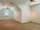 A spacious bonus room featuring neutral carpeting and a ceiling fan for a comfortable and adaptable living space at 5123 Upper Elm St, Atlanta, GA 30349