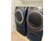 A sleek, matching washer and dryer set with smart features and front-load design, perfect for modern convenience at 5123 Upper Elm St, Atlanta, GA 30349