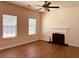 Cozy living room with hardwood floors, fireplace, and large windows providing plenty of natural light at 5123 Upper Elm St, Atlanta, GA 30349