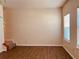 Bright, spacious living room with hardwood floors, natural light, and stairs leading to upper level at 5123 Upper Elm St, Atlanta, GA 30349