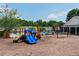 A vibrant community playground with colorful equipment and a soft mulch surface, offering a safe and fun play area at 5123 Upper Elm St, Atlanta, GA 30349