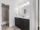 Modern bathroom featuring a sleek vanity with ample storage and a well-lit mirror at 6 Stratford Hall Ne Pl, Atlanta, GA 30342