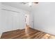 Inviting bedroom with wood floors, closet, and view to the hallway at 6 Stratford Hall Ne Pl, Atlanta, GA 30342