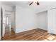 This is a bedroom with hardwood floors and closet with door view at 6 Stratford Hall Ne Pl, Atlanta, GA 30342