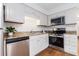 Well-equipped kitchen with stainless steel appliances, granite countertops and ample cabinet space at 6 Stratford Hall Ne Pl, Atlanta, GA 30342