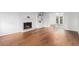 Spacious living room with hardwood floors, fireplace, built-in shelves and sliding glass doors at 6 Stratford Hall Ne Pl, Atlanta, GA 30342