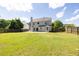 Large backyard featuring a patio and privacy fence at 895 Roxfield Ct, Buford, GA 30518