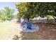 A backyard fire pit area has Adirondack chairs for enjoying time outdoors at 895 Roxfield Ct, Buford, GA 30518