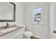 Well-lit bathroom featuring modern fixtures, and a granite countertop vanity at 895 Roxfield Ct, Buford, GA 30518