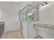 Bathroom boasting gray vanity and walk-in shower with a glass surround at 895 Roxfield Ct, Buford, GA 30518