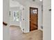 Entryway with wood floors, stylish front door, and a view of the adjacent room at 895 Roxfield Ct, Buford, GA 30518