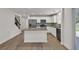 Bright and open kitchen with granite countertops and stainless steel appliances at 895 Roxfield Ct, Buford, GA 30518