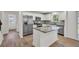 Spacious kitchen with stainless steel appliances, granite countertops, and an island at 895 Roxfield Ct, Buford, GA 30518