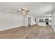 Large living room with an open floor plan leading into kitchen and dining areas at 895 Roxfield Ct, Buford, GA 30518