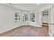 Cozy living room with ample natural light, hardwood flooring, and closet space at 895 Roxfield Ct, Buford, GA 30518
