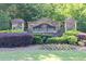 Stone monument sign for Roxwood Park with colorful landscaping at 895 Roxfield Ct, Buford, GA 30518