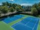 Aerial view of the community tennis courts with recreational play area at 895 Roxfield Ct, Buford, GA 30518