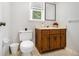 Functional bathroom featuring tile flooring, a vanity, and a toilet at 1828 Brandy Woods Se Dr, Conyers, GA 30013