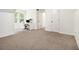Bright bedroom features carpet flooring, a work desk, and great natural light at 1828 Brandy Woods Se Dr, Conyers, GA 30013