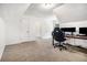 Spacious bedroom with carpet flooring and a dedicated workspace at 1828 Brandy Woods Se Dr, Conyers, GA 30013