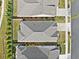 Aerial view showcasing the home's roof, driveway, landscaping, and neighborhood layout at 209 Floral Valley Dr, Woodstock, GA 30188