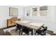 Elegant dining room showcasing a modern table, statement art, and natural light, ideal for entertaining at 209 Floral Valley Dr, Woodstock, GA 30188