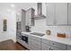 Beautiful kitchen with gray cabinetry, stainless appliances, and an abundance of counter space at 209 Floral Valley Dr, Woodstock, GA 30188