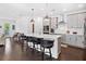 Stylish kitchen with a large island, pendant lighting, stainless steel appliances, and sleek gray cabinetry at 209 Floral Valley Dr, Woodstock, GA 30188
