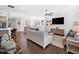 Open living room with hardwood floors, ceiling fan and natural light at 209 Floral Valley Dr, Woodstock, GA 30188